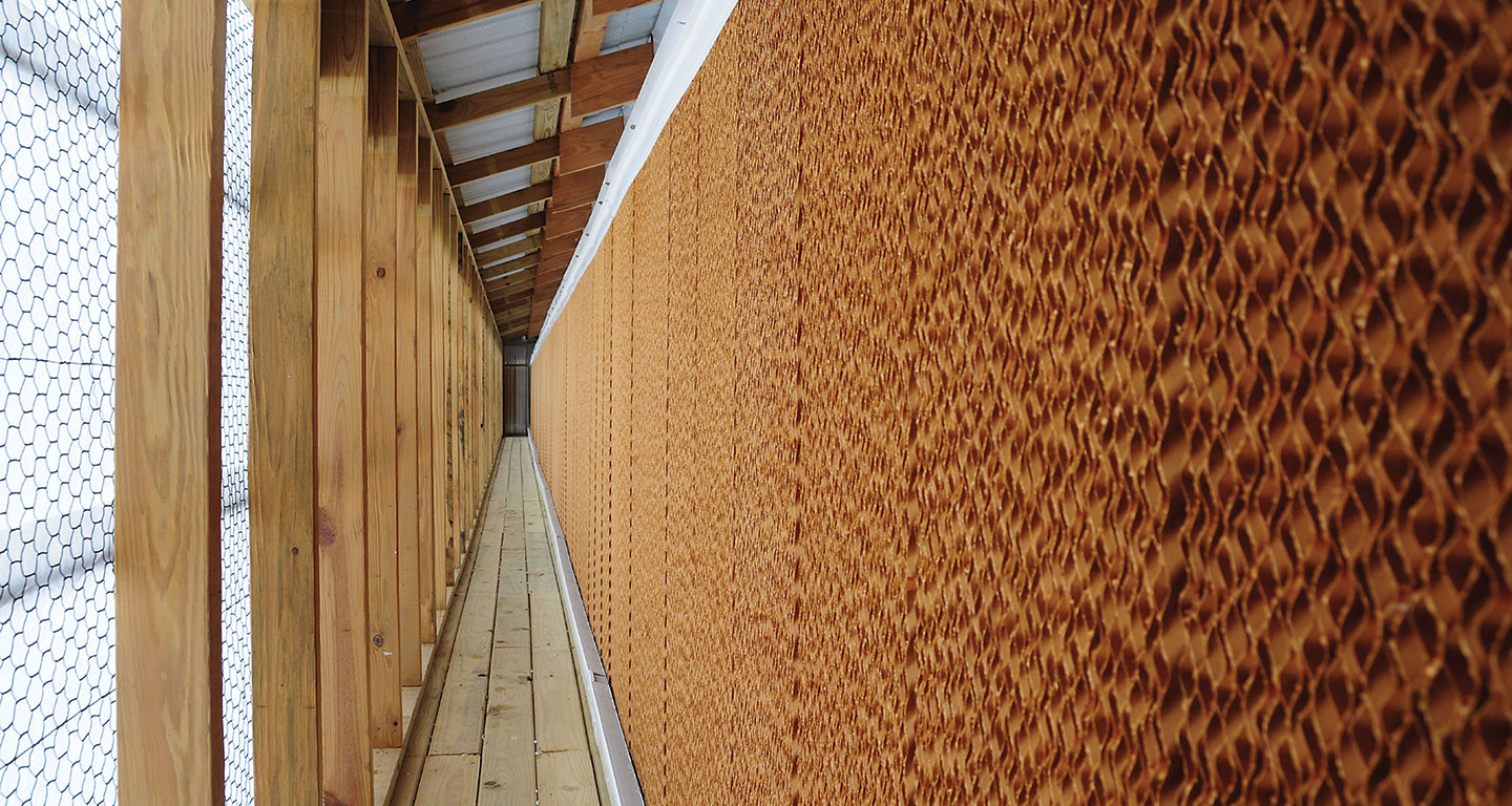 Evaporative shop cooling wall