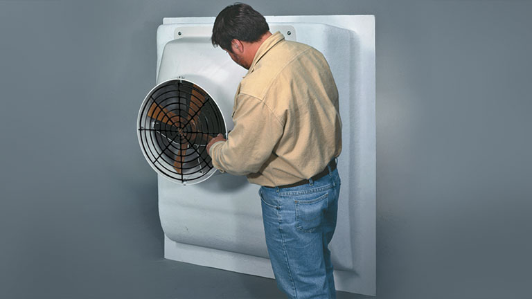 Worker installing transit tub onto AP fan